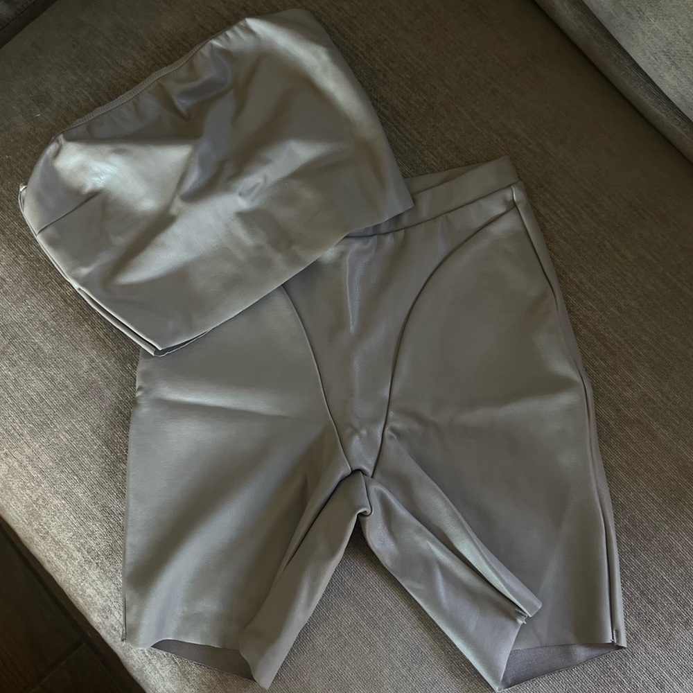 Sold out SKIMS faucet leather biker short and tube top set on cement